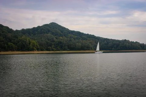 Looking at the surface of a large and beautiful mountain lake Stock Photos