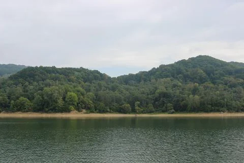 Looking at the surface of a large and beautiful mountain lake Stock Photos
