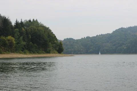 Looking at the surface of a large and beautiful mountain lake Stock Photos