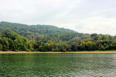 Looking at the surface of a large and beautiful mountain lake Stock Photos