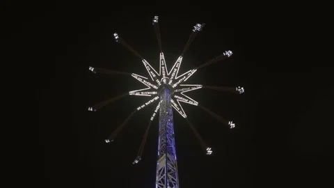 Looking up at Swing ride at night. Stock Footage 83536155