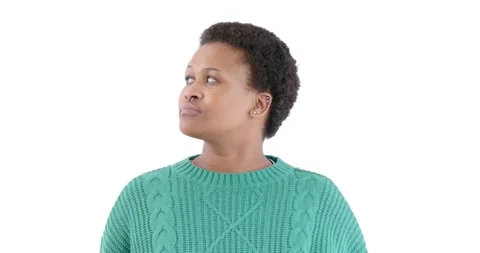 Looking thoughtful and pensive, African American woman in green sweater gazing Vídeo Stock 346367060
