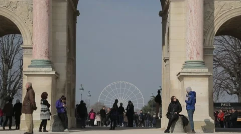Looking through Arc de Triomphe du Carrousel to Roue De Paris - Paris, France Video stock 61236720
