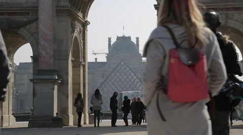 Looking through Arc de triomphe du Carrousel at Pyramide du Louvre. Paris Stock Footage 61236754