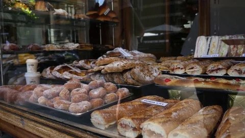 Looking through a bakery window Stock-Footage 75699762