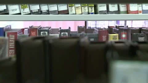 Looking through the book shelves at the library (2 of 3) Stock Footage 10774672