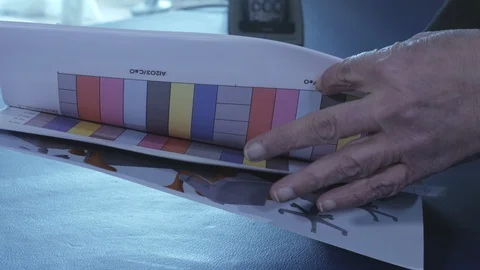 Looking through brochure Stock Footage 111360572