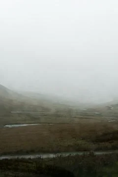 Looking through a car window blurred by raindrops on a bleak  moorland Stock Photos