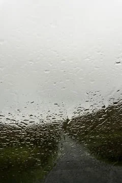Looking through a car window blurred by raindrops on a bleak  moorland Stock Photos