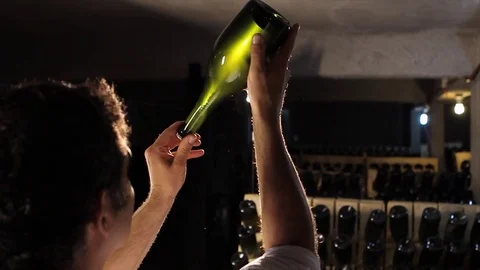 Looking through champagne bottle Stock Footage 77099788