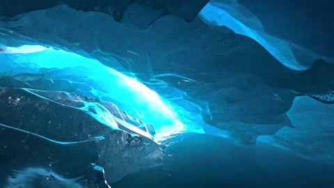 Looking Up Through a Crystal Ice Cave Toward Bright Blue Sunlight Stock-Footage 341212643
