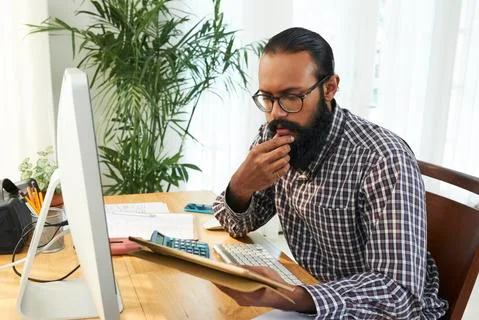 Looking through data Stock Photos