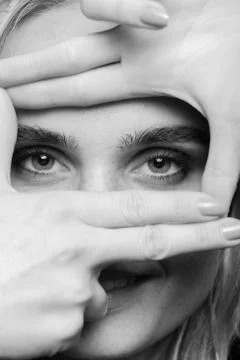 Looking through fingers Photos