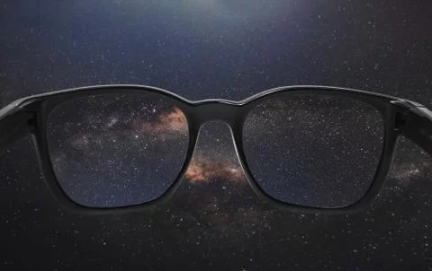 Looking through glasses on the sky full of star in starry night Stock Photos
