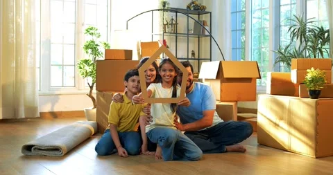 Looking through house shaped cutout, happy Indian family smiling 스톡 동영상 342487947