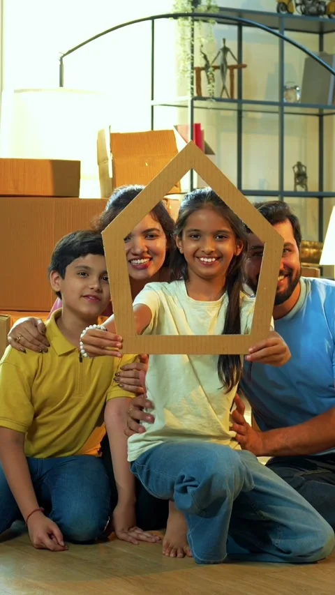 Looking through house shaped cutout, happy Indian family smiling Stock-Footage 342499524