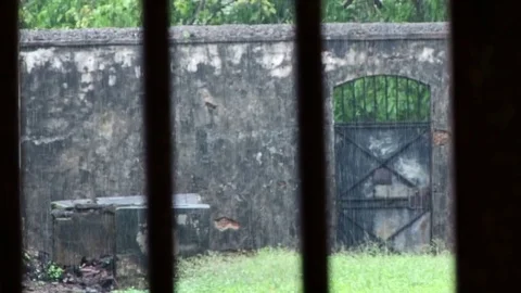 Looking through jail bars Devils Island Stock-Footage 76868490