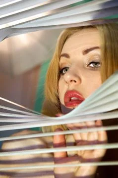 Looking through jalousie Stock Photos