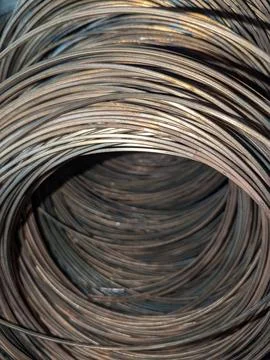 Looking Through a Large Coil of Rusted Industrial Steel Wire in a Warehouse.. Stock Photos
