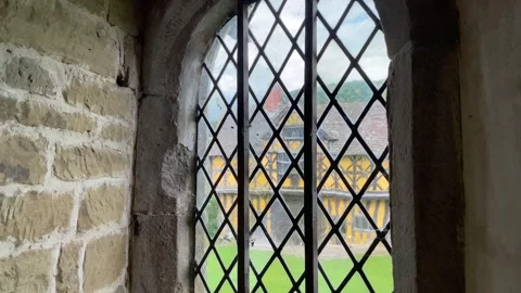 Looking through leaded window, Stokesay Castle, England, UK Stock Footage 280761036