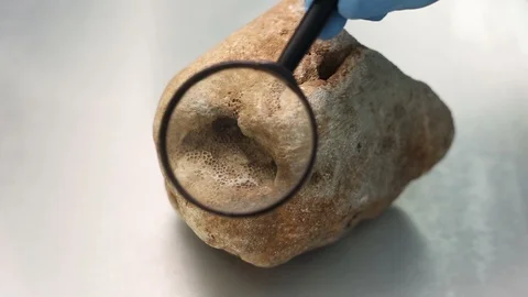 Looking through loupe on the stone surface. Video stock 97214248