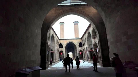 Looking Through the Main Iwan into the Courtyard of Twin Minaret Madrasa in Stockbeeldmateriaal 330983530