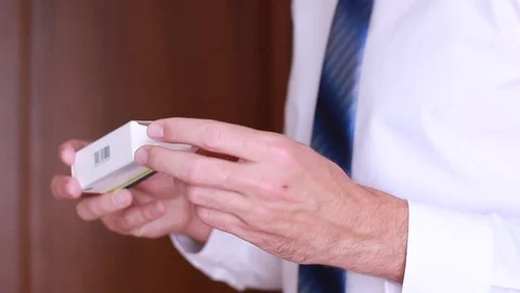 Looking through medicine instruction list Stock Footage 90834065