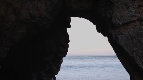Looking through an ocean cave and into the depths of natural beauty 库存影片 112893758