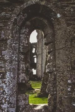Looking through old castle window at ruins Stock Photos