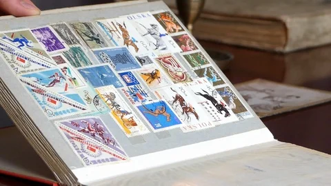 Looking Through Old Collection of OldSoviet Stamps Video stock 113962478