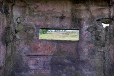 Looking through a peephole to the enemy. Stock Photos