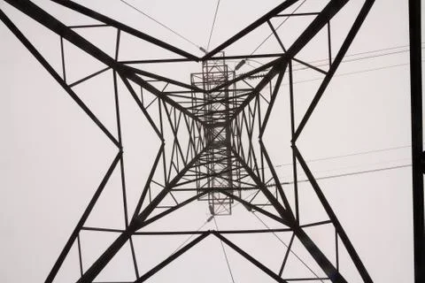 Looking up through pylon in mist Stock Photos