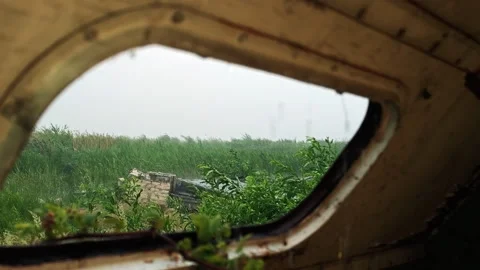 Looking Up Through Roof Window of Abandoned Trailer at Heavy Rain Stock Footage 339590293