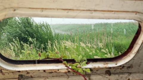 Looking Up Through Roof Window of Abandoned Trailer at Heavy Rain Stock Footage 339591337