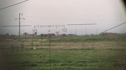 Looking through a scope at the ISIS frontline outside of Sinjar, Iraq Stock Footage 60639436