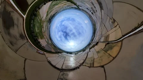 Looking up through a spiraling metal tunnel Stockbeeldmateriaal 345395923