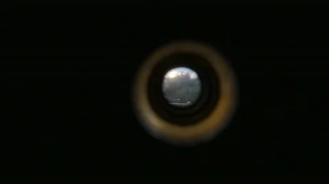 Looking Through Spy Hole at Hotel with Palm Trees and Blue Skies, 4K Stock Footage 61535404
