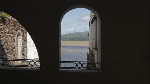 Looking through stone arch window Stock Footage 128501108