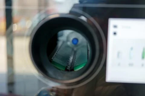 Looking through a telescope at a scenic view of a railway in a park during .. Stock-Fotos