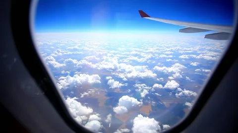 Looking through window aircraft during flight in wing with a nice blue sky. HD Stock Footage 46949853