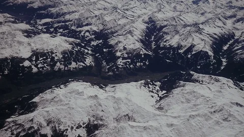 Looking through the window aircraft during flight a snow covered Italian and Stock Footage 75836020