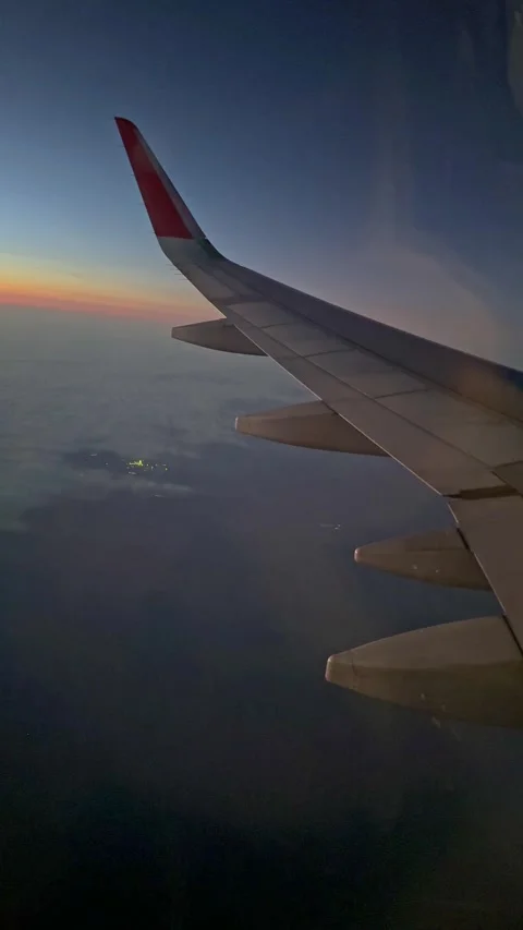 Looking through window aircraft during flight in wing with a nice blue sky.  Stock Footage 265888920