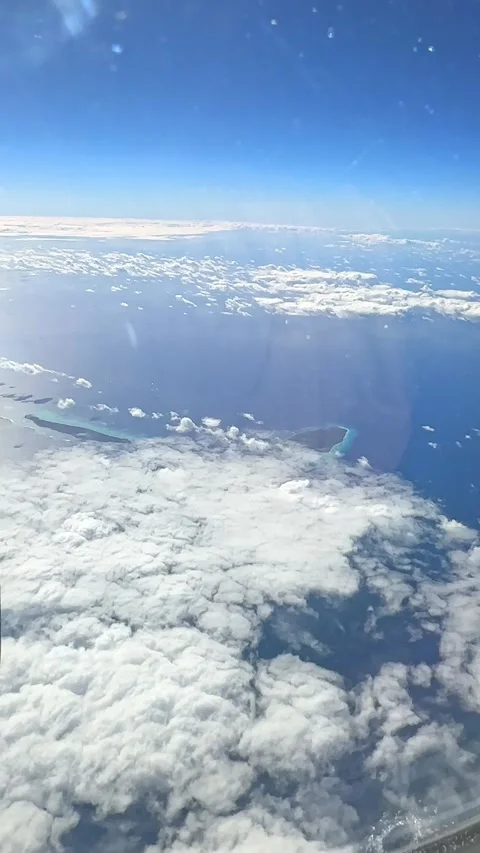 Looking through window aircraft during flight in wing with a nice blue sky.  Stock Footage 265889189