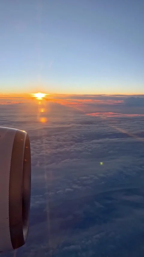 Looking through window aircraft during flight in wing with a nice blue sky.  Stock Footage 265889468