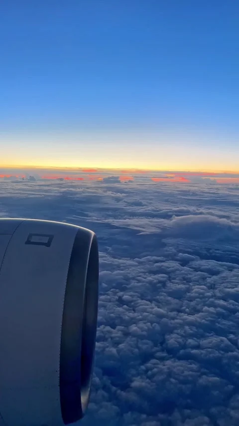 Looking through window aircraft during flight in wing with a nice blue sky.  Stock Footage 265889475
