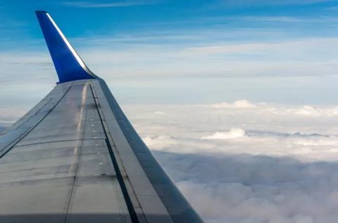 Looking through window airplane during flight in wing Stock Photos