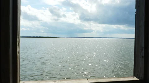 Looking Through Window at Bay and Sky, 4K Stock Footage 53083574