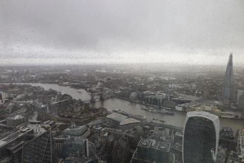 Looking through a window at the cloudy London skyline 스톡 사진