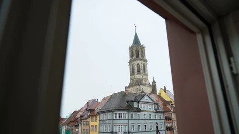 Looking through window down at European town in the rain Stock Footage 122174552