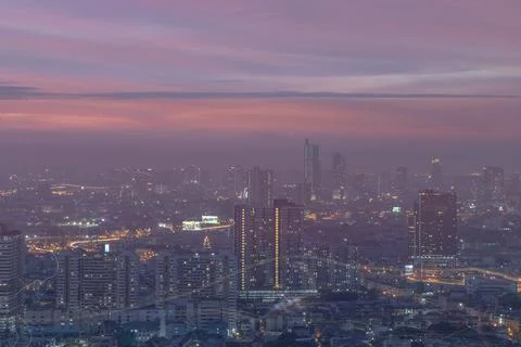 Looking through the window mirror to see The cityscape of Bangkok. Stock Photos